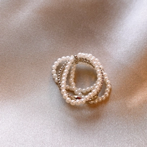 French vintage multi-layer pearl open ring with gold plating on champagne silk cloth