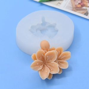 Round silicone mold with 3D cherry blossom flower shapes for DIY cake baking and crafts