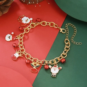 Detailed shot of Christmas charm bracelet with Santa, reindeer and red bell pendants
