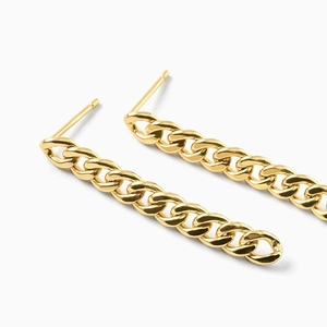 Golden Cuban chain hoop earrings with a polished metallic finish on a white background