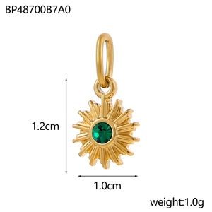 Detailed size view of a gold sun pendant featuring a green zircon center stone