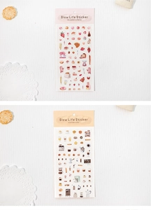 Close-up of vintage Strawberry Party and Coffee Life stickers for scrapbooking and DIY