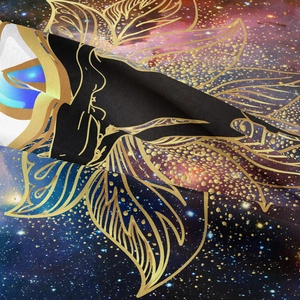 Close-up of golden artistic lines and deep nebula patterns on fabric tapestry