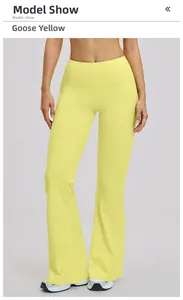 Close-up of high-waist slimming yoga flare pants in goose yellow breathable fabric