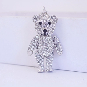 Sparkling crystal teddy bear keychain with silver rhinestones on a white background