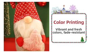 Detail of red and grey Christmas gnome with knitted hat and plush heart decoration