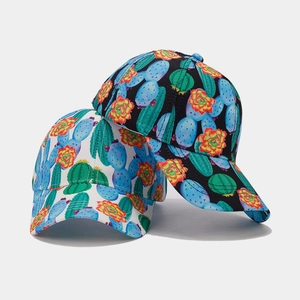 Close-up of tropical cactus prints on high-quality black and white baseball caps