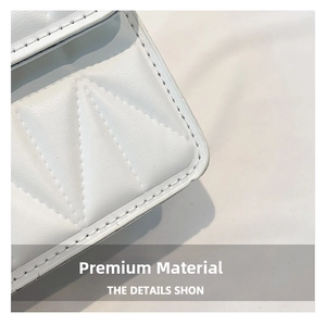 Macro shot of white quilted leather texture with premium triangular stitching details