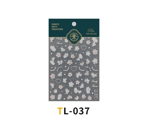 Detail of 3D embossed nail stickers featuring white floral patterns and pearl accents