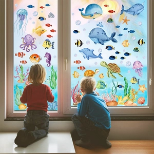 Detailed view of sea world window decals featuring whales and turtles in a child's bedroom