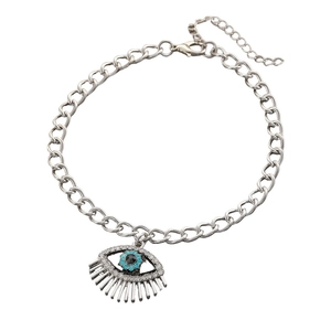 Macro shot of silver evil eye bracelet with blue rhinestones and lobster clasp