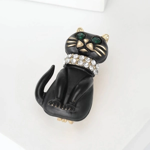 Black enamel cat brooch with green crystal eyes and rhinestone collar in gold finish