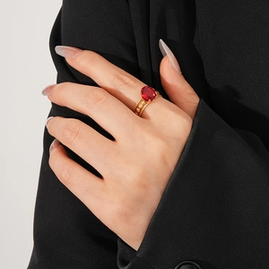 Detail view of vintage gold layered ring featuring a large oval red ruby zircon stone