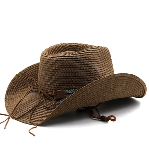 Detail of straw cowboy hat with ethnic woven band and adjustable chin strap
