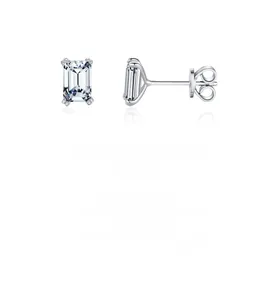 Detail view of silver stud earrings featuring emerald-cut cubic zirconia in four-prong setting