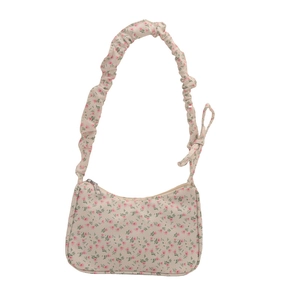 Minimalist beige floral shoulder bag with pink patterns and ruffled strap design