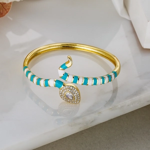 Bohemian gold snake cuff bracelet with teal enamel and sparkling white cubic zirconia