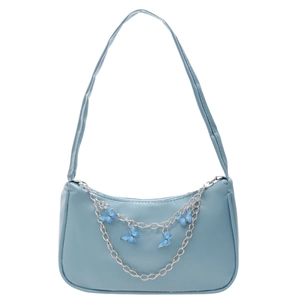 Light blue faux leather underarm bag with decorative silver butterfly chain charm