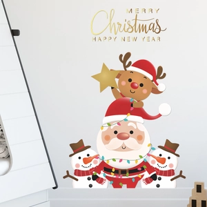 Macro detail of Santa, reindeer, and snowman wall stickers on a clean white interior wall