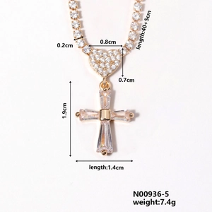 Detail view of gold heart and cross necklace with measurements and zircon inlays