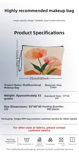 Detail of floral linen cosmetic bag showing 17x25cm size and pink tulip pattern