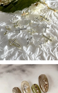 Exquisite gold and silver alloy cross nail charms with rhinestones on textured paper