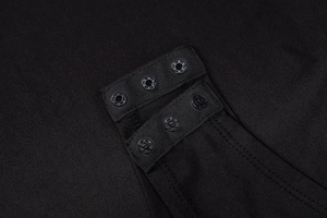 Detail view of black bodysuit bottom with three metal snap buttons and knit fabric