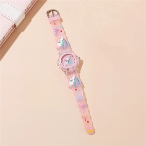 Detail view of pink silicone watch strap with embossed cartoon unicorns and stars