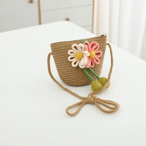 Handwoven straw crossbody bag for girls featuring 3D crochet flowers and metal zipper