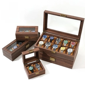 Detail view of walnut wood watch boxes with glass windows in 2, 3, 6, and 10 slot versions