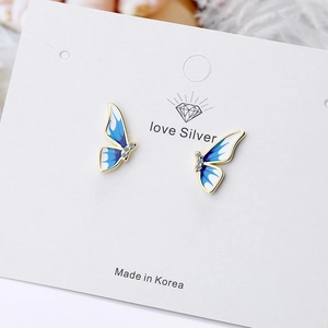 Elegant gold-edged blue enamel butterfly earrings with gradient wings and small diamond accents