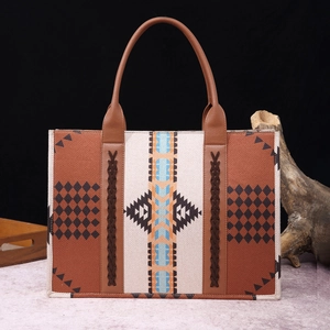 Close-up of bohemian tote bag with geometric patterns and brown leather straps