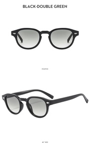 Detail of vintage round black sunglasses with double green lenses and metal rivets