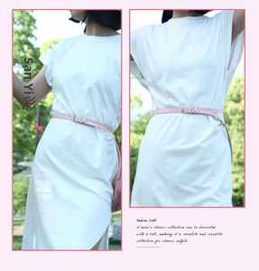 Detail of slim pink faux leather waist belt with classic golden pin buckle on dress