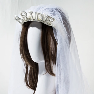 Detailed view of bridal headband featuring 3D pearl BRIDE lettering and tulle veil