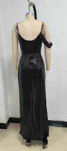 Detail of black sequin evening dress featuring slim straps and a deep backless design