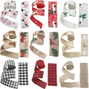 Various Christmas linen ribbons with snowmen and reindeer patterns for gift wrapping