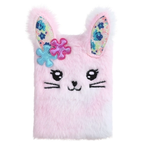 Close-up of pink plush bunny notebook with soft fur texture and floral ear details