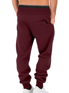 Back view of burgundy joggers with drawstring waist and ribbed ankle cuffs