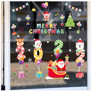 Window display of Santa Claus and reindeer Christmas stickers with Merry Christmas text