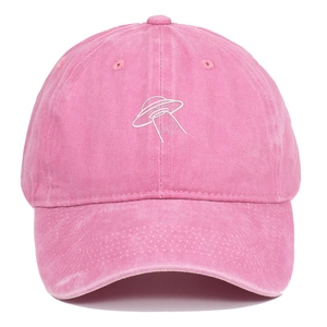 Detail of pink washed cotton baseball cap with white UFO embroidery and vintage texture