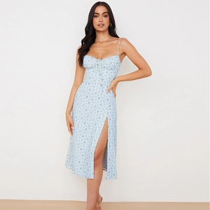 Detail of light blue floral midi dress featuring a sweetheart neckline and high side slit