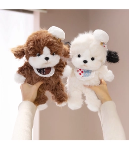 Close-up of soft plush puppy toys with floral lace bibs held in hand for comfort