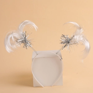 Detail of a white feather headband with silver sequin springs for festive party costumes