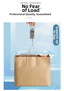 Strong brown kraft paper gift bag with flat handles demonstrating heavy load capacity