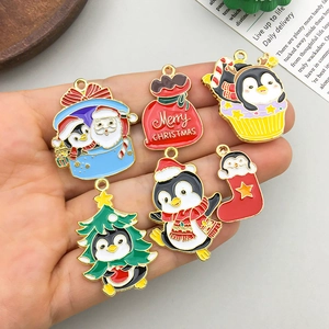 Set of 6 cute Christmas penguin enamel charms and pins in gold finish metal