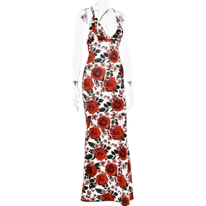 Detailed view of white maxi dress with red rose floral print and elegant V-neckline