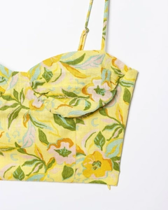 Detail of floral linen blend camisole showing yellow print and fine fabric texture