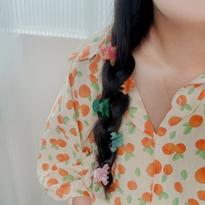Mini colorful acetate claw clips set used as hair accessories for braided hairstyles