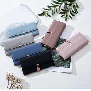 Long multi-slot leather wallet for women in multiple pastel colors with leaf pendant